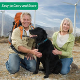 FelRelWel Dog Flirt Pole dog teaser wand used by happy couple playing with black dog outdoors